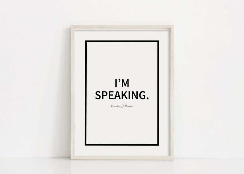 May include: A white framed print with a black border and the text "I'M SPEAKING." in black font. The text "Kamala D. Harris" is written in a smaller font below the main text.