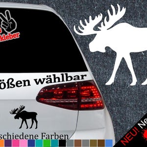 Könnte beinhalten: Ein weißer Elch-Silhouetten-Aufkleber mit dem Text "6 Größen wählbar" und "21 verschiedene Farben" in Schwarz. Der Aufkleber ist auf der Rückseite eines Autos mit einem roten Rücklicht zu sehen. Der Text "NEU! Neonfarben" befindet sich in der unteren rechten Ecke des Bildes.