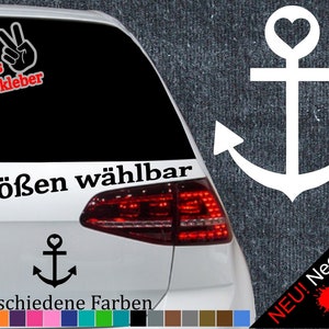 Könnte beinhalten: Ein weißer Anker mit einem Herzen oben, mit dem Text "6 Größen wählbar" und "21 verschiedene Farben" darunter. Der Anker befindet sich auf einem weißen Auto mit schwarzem Hintergrund. Der Text "NEU! Neonfarben" befindet sich in der rechten unteren Ecke des Bildes.