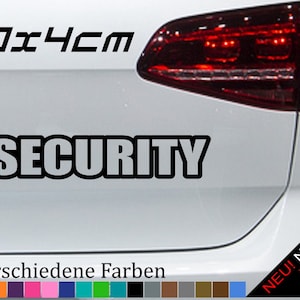 May include: A white car with a black "SECURITY" sticker on the back. The sticker is 20 x 4 cm and is available in 21 different colors.  The car has a red taillight and a "NEU! Neonfarben" sticker on the lower right corner.