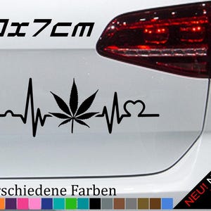 May include: Black vinyl car sticker featuring a cannabis leaf within a heartbeat design, measuring 20 x 7 cm. The sticker includes the text "21 verschiedene Farben" and a colour palette.
