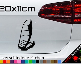 May include: Black silhouette of a windsurfer on a white car with the text "20x11cm" and "21 verschiedene Farben" in black. The car has a red taillight and the text "NEU! Neonfarben" in yellow, red, and green.