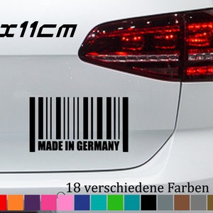 Peut inclure: Un autocollant de code-barres noir et blanc avec le texte "Made in Germany" sur une voiture blanche. L'autocollant mesure 20 x 11 cm. La voiture a un feu arrière rouge. L'image montre également 18 options de couleurs différentes pour l'autocollant.