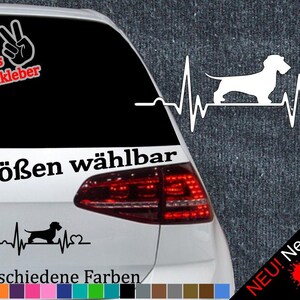 Könnte beinhalten: Ein schwarz-weißes Aufkleber mit einem Dackel mit einem Herzschlag-Motiv und dem Text "6 Größen wählbar" und "21 verschiedene Farben".