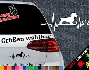 May include: A black and white decal of a dachshund with a heartbeat graphic and the text "6 Größen wählbar" and "21 verschiedene Farben".
