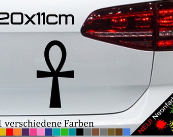 May include: Black Ankh symbol decal for a car. The decal is 20 cm by 11 cm. The decal is shown on a white car. The text "NEU! Neonfarben" is visible in the lower right corner of the image.  21 different colors are available.