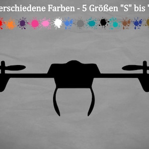 Puede incluir: Silueta negra de un dron con cuatro hélices. El dron está centrado en la imagen sobre un fondo gris.