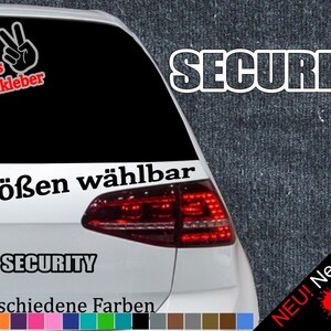 May include: A white car with a black "SECURITY" sticker on the back window. The sticker has a peace sign and the text "+ Gratis Testaufkleber". The car also has a black sticker that says "6 Größen wählbar" and "SECURITY". The car has a red taillight and a sticker that says "NEU! Neonfarben" with three paint splatters in red, yellow, and green.