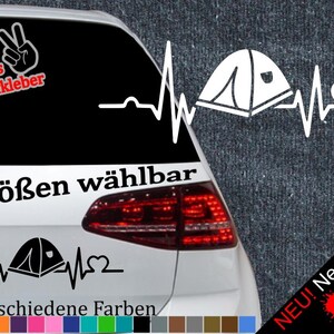 May include: White car decal featuring a tent within a heartbeat line, with the text "6 Sizes Available" and "21 Different Colors". Includes a peace sign and the words "+ Free Test Sticker".