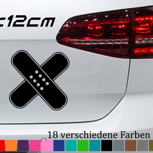 May include: A black and white sticker of a bandage with the text "12x12cm" above it. The sticker is on a white car. The image shows 18 different color options for the sticker.