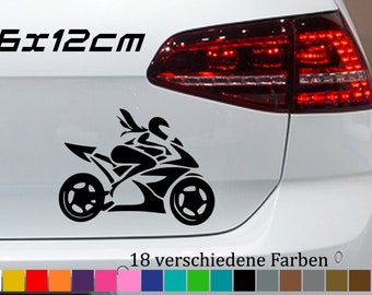 May include: Black and white decal of a motorcycle rider on a white car. The decal is 15 inches by 12 inches. The image shows 18 different color options for the decal.