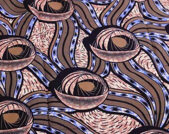 May include: Close-up of a fabric with a repeating pattern. The design features large, stylized circular shapes with a spiral center, surrounded by curved lines in shades of brown, black, and blue. The background has a pinkish hue.
