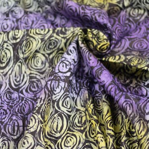 Purple roses resemble hand printed African batik adire cotton fabric sold by the Yard