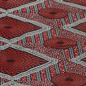 May include: Red and white fabric with a geometric pattern of diamonds and circles. The fabric has a textured surface and a black outline.