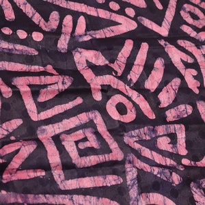 Multi patterned pink art symbols Nigerian adire batik hand printed shapes in colours fabric sold by the Yard