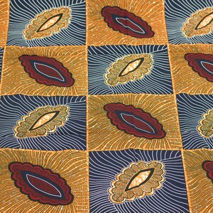 May include: A fabric with a repeating pattern of stylized leaves in shades of gold, brown, red, and blue. The leaves are outlined in white and have a textured appearance.