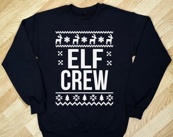 Abbigliamento natalizio dell'equipaggio di elfi, stampato in bianco su un maglione natalizio, un regalo festivo per Natale e può essere abbinato