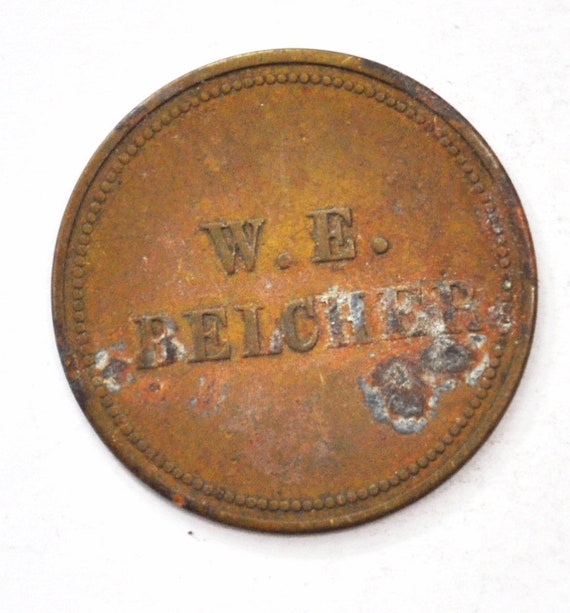 W.E. Belcher Trade Token 1 One Dollar in Merchandi