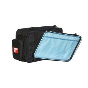 May include: Black rectangular bag with a detachable, light blue interior compartment. The bag has a side pocket with the text "ANI JI" in red and white. The bag is designed for carrying items.