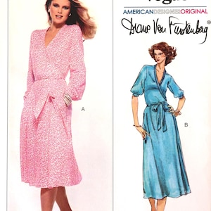 May include: Vogue sewing pattern featuring two wrap dresses. One dress is pink with a small pattern, long sleeves, and a tie waist. The other dress is blue with short sleeves and a tie waist. The pattern is designed by Diane Von Furstenberg.