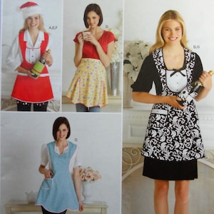 May include: Simplicity sewing pattern 2298 for aprons in sizes S, M, and L. The envelope displays four variations of aprons: a red holiday apron, a yellow floral apron, a black and white damask print apron, and a light blue checkered apron.