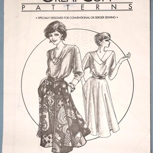 May include: A sewing pattern envelope labeled Great Copy Patterns #1230 for a cross-over V top and 4 gore skirt. The front features a black and white illustration of two figures wearing the garments, with text stating it is designed for conventional or serger sewing.