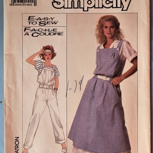 May include: A Simplicity 8124 sewing pattern envelope for size K (8+10+12). The cover features illustrations and photographs of a jumper and overalls. The text includes "Simplicity", "E-A-S-Y TO SEW", "F-A-C-I-L-E A COUDRE", and "PATTERN/PATRON".