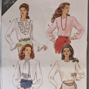 May include: Illustration of four different blouses. The blouses are in various styles, including a ruffled front, a pussy bow, and a simple crew neck. The blouses are shown in white and pink, with long sleeves and various skirt and pant combinations.