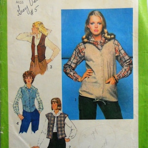 May include: A Simplicity 8685 sewing pattern envelope featuring illustrations and a photograph of vests worn over long-sleeved shirts. The package displays the number 8685, size 10, and a price of $1.75. The design includes various vest styles with buttons, pockets, and drawstring hems.