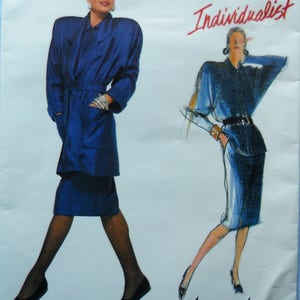 May include: Vogue Patterns Individualist sewing pattern featuring a woman in a blue suit and coat. The pattern includes a drawing of a woman in a similar outfit. The pattern number is 1823.