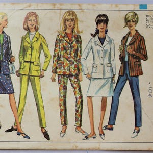 May include: A vintage Simplicity sewing pattern envelope, number 6975, size 12, bust 32. The illustration features five figures wearing various blazer and skirt or pant combinations in floral, polka dot, and striped patterns with button closures.
