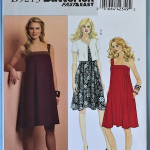 May include: A Butterick sewing pattern, B5213, featuring illustrations of dresses. The pattern includes a burgundy dress with brown straps, a black and white floral dress with a white jacket, and a red dress. The pattern size is F5 (16-18-20-22-24).