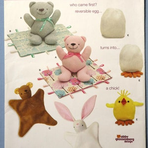 Simplicity 1681.   Stuffed bear,  blanket bear,  blanket bunny, and chick egg toy pattern.  Baby soft toys pattern.  Uncut