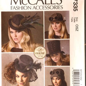 May include: McCall's M7335 fashion accessories sewing pattern envelope featuring five hat designs labeled A through E. The images display various headwear styles including hats with goggles, peacock feathers, lace accents, and a tall top hat structure.