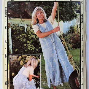 May include: A sewing pattern envelope titled Favorite Things Pattern Designs V006 featuring a light blue plaid button-front jumper. The cover displays a front and back view of the garment, with the text Violets R Blue Collection the button jumper.