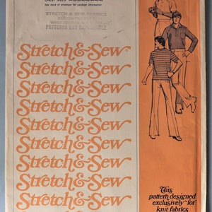 May include: A vintage sewing pattern envelope for a T-shirt and tab front shirt, pattern number 1750. The cream-colored paper features the repeating orange text Stretch & Sew and illustrations of two figures wearing shirts and pants.