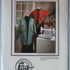May include: An advertisement for a sewing pattern featuring two jackets. One is teal with embroidery, the other is red with gold trim. A sewing machine is on a white surface. Text reads "Baubles & Bangles Jacket" and "interesting clothing to sew."