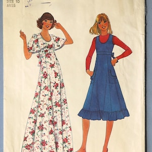 May include: Simplicity sewing pattern 8026 featuring two dress designs. One dress is a long, white floral print with red roses. The other is a blue jumper dress with a red long-sleeve shirt underneath. The pattern is size 10 Miss.