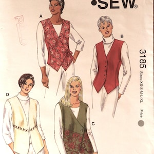 May include: A Kwik Sew pattern envelope 3185 for vests in sizes XS-S-M-L-XL. The cover features illustrations of four vest styles labeled A, B, C, and D, worn over white long-sleeved tops. The designs include floral prints, solid colors, and decorative stitching.