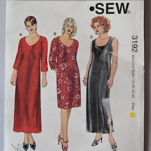 May include: A Kwik Sew pattern envelope 3192 for dresses in sizes 1X-4X. The front displays three illustrations: a solid red long-sleeve dress, a floral print dress with three-quarter sleeves, and a sleeveless black dress. Includes text and barcode.