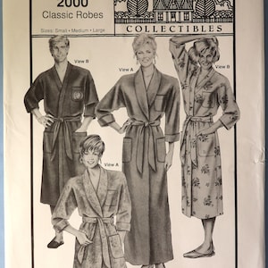 May include: A vintage pattern for classic robes, featuring illustrations of various robe styles. The pattern includes sizes small, medium, and large. The image also displays the "Ann Person Collectibles" logo and "Stretch & Sew" branding.