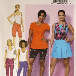 May include: Butterick sewing pattern B6460 for activewear including a sleeveless top, short-sleeve top, shorts, leggings, and a pleated skirt. The illustrations show various color combinations including orange, blue, purple, and patterned fabrics.