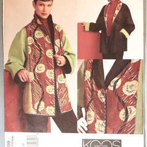 May include: A sewing pattern envelope for a Koos Couture jacket by Koos Van Den Akker, Vogue American Designer pattern 2709. The jacket features light green sleeves, a dark brown collar, and a front panel with a red, white, and blue floral pattern.