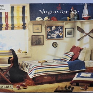 May include: A nautical-themed bedroom with a bed featuring striped bedding in red, blue, and yellow. The room includes a window with a striped shade, framed artwork, decorative oars, and a shelf with nautical decor. A chess set sits on the floor.