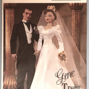 May include: A Vogue Doll Collection sewing pattern envelope 7676 featuring Gene and Trent. The image shows a doll in a white wedding gown with a veil and bouquet, and a doll in a black pinstripe tuxedo with a white vest and black bowtie.