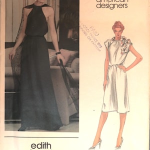 May include: A Vogue American Designers sewing pattern envelope featuring Edith Head designs. The cover displays a black floor-length halter dress with a sheer cape and a white knee-length dress with a floral neck detail. Text includes Vogue American designers, edith head, and 2692.