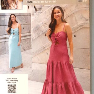 May include: A sewing pattern package featuring a woman in a light blue dress and a pink dress. The package includes the text "knowME" and "SIZE K5 (8-10-12-14-16)". The package also includes the text "Designed and printed in USA".