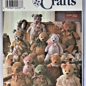 May include: A Simplicity Crafts pattern featuring various teddy bears. The bears are made of different fabrics and patterns, including floral, polka dot, and patchwork designs. Some bears have bows and lace collars. The pattern number is 8418.
