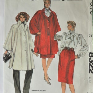 May include: A McCall's sewing pattern envelope labeled 8322 featuring illustrations of three outfits: a white cape with black trousers, a red coat with a matching skirt, and a white long-sleeved blouse with a red skirt. The text reads Halston.