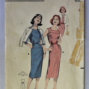 May include: A vintage Butterick 8531 printed sewing pattern envelope for size 12, bust 32. The illustration features two figures wearing a blue dress with a white jacket and a red and white striped dress, with a third figure in the background.